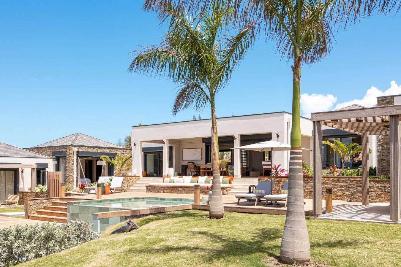 The villa behind the palms