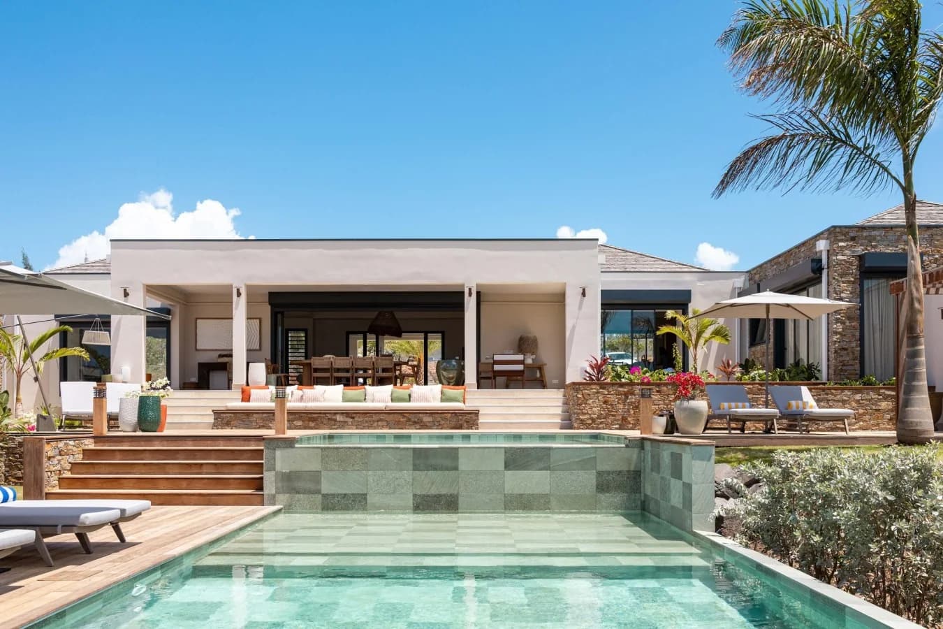 The villa façade above the pool
