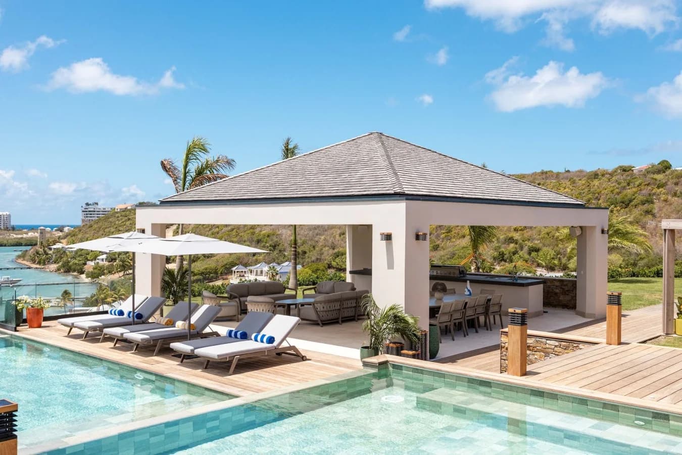 The pavilion and sun loungers at the water’s edge