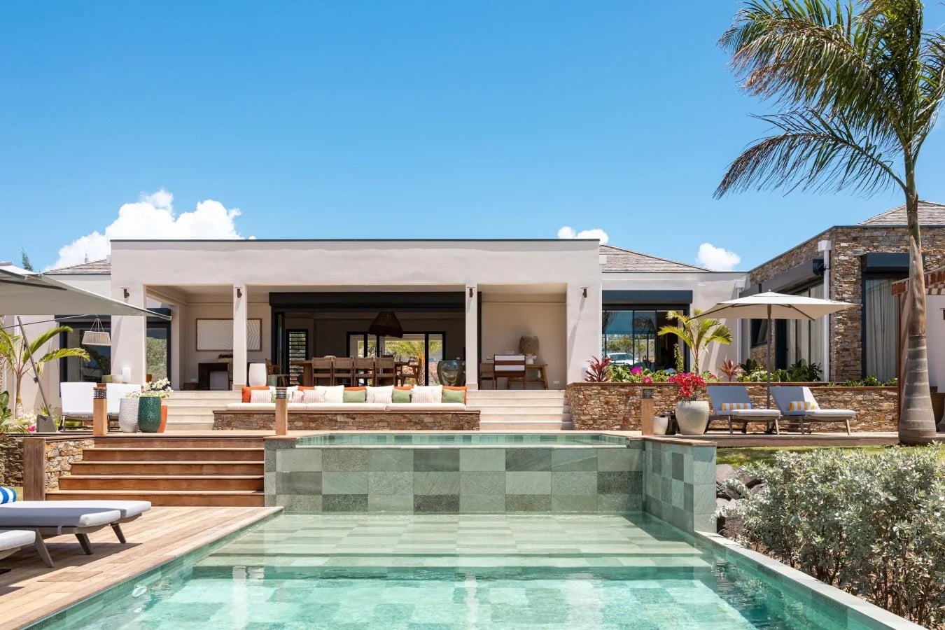 The villa façade above the pool